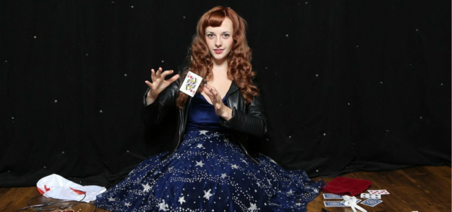 Magical Katrina performing a card trick