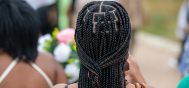 back of womans head showing a braided hairstyle