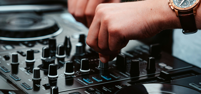 Youth or Teen playing music at DJ Turntable.