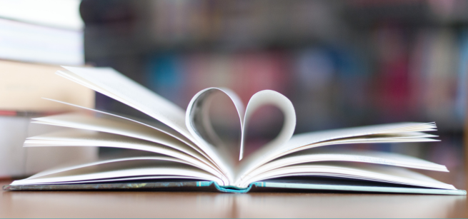 Picture of book pages folding into a heart