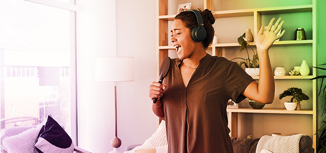 woman singing while holding a hairbrush
