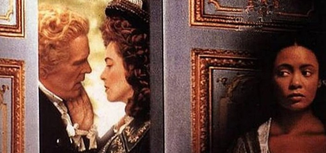 man, and a woman by the doors another woman behind the door