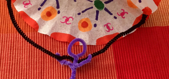 coffee filter parachute and a person made out of chenille sticks