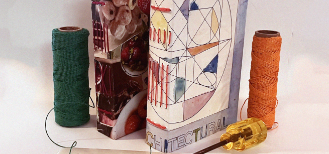 two balls of string sit on either side of two stitch-bound books.