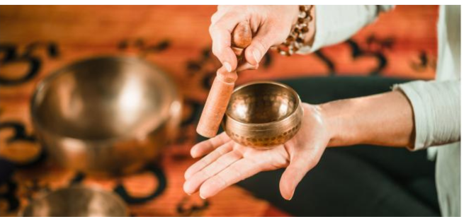 hand holding a soundbath
