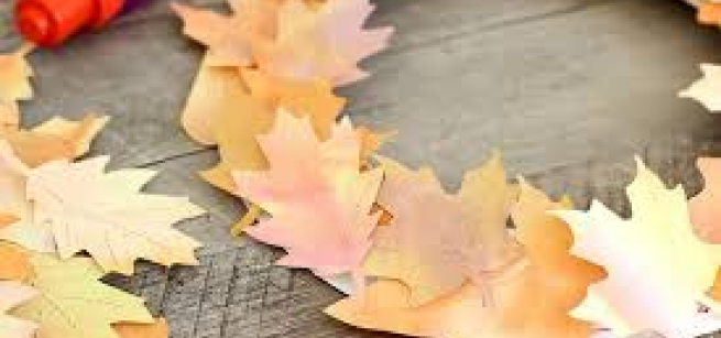 a wreath made of brown and orange autumn leaves