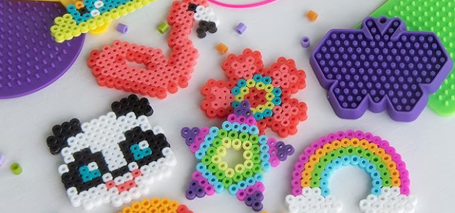 Image of various completed perler bead art and beads.