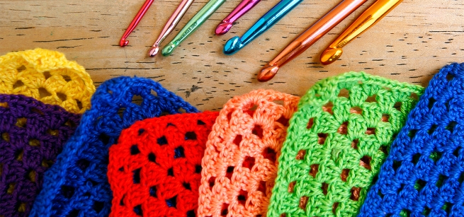 colorful crochet squares and crochet hooks