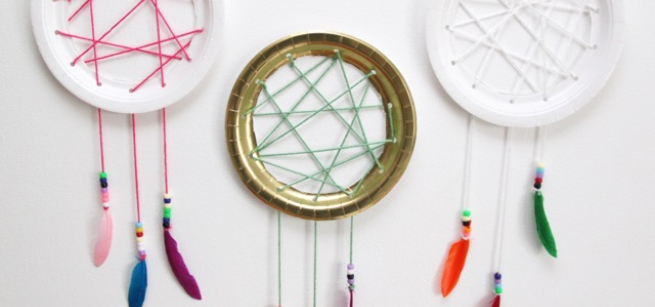 Three dream catchers made with paper plates.