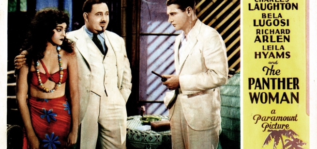 two man and a woman standing in a room looking at one another