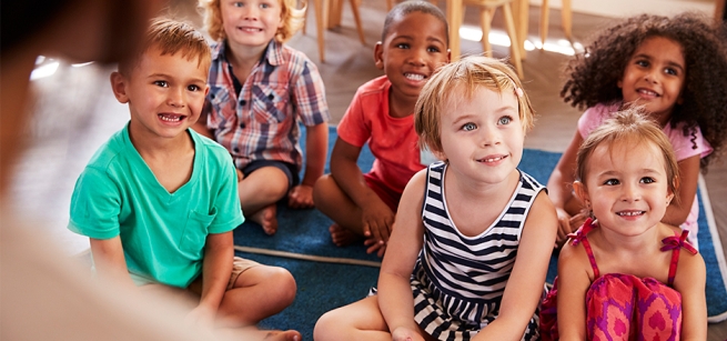 Kids sitting and listening to a story