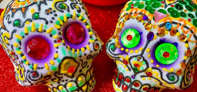 Image of two decorated sugar skulls.