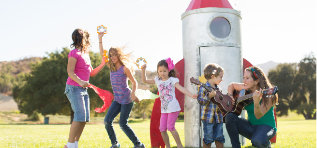 Nathalia Palis singing with kids
