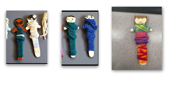 Handmade worry dolls with yarn and popsicle stick people