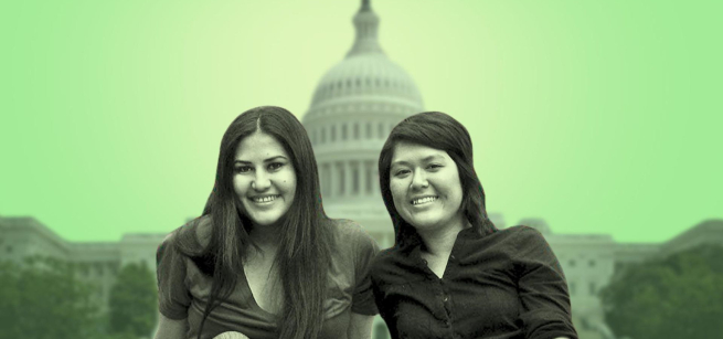 A green-filtered photo of two smiling women, one with long dark hair parted in the middle and the other with side-parted bangs and shoulder length dark hair, both wearing dark colored, collared shirts are centered over with the U.S. Capitol building in the background