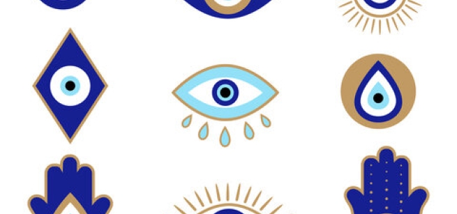 Wallpaper with blue and gold evil eye symbols