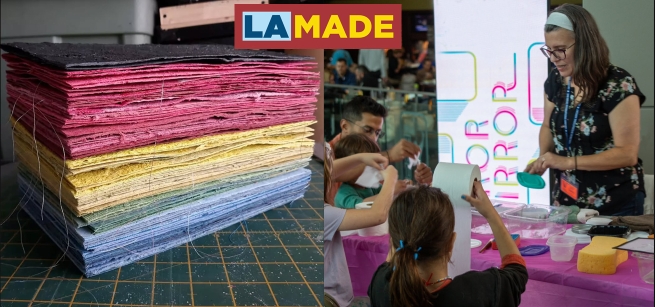 a stack of handmade paper and a women showing kids how to make paper