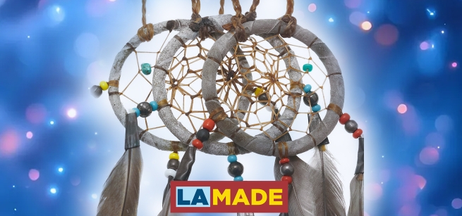 dreamcatcher against a sparkly blue background