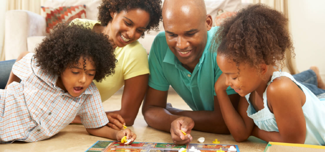 A family with children are playing board games.