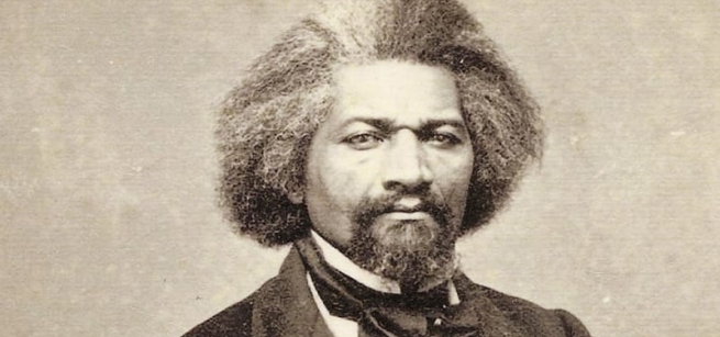 Black and white photo of Frederick Douglass in 19th century suit