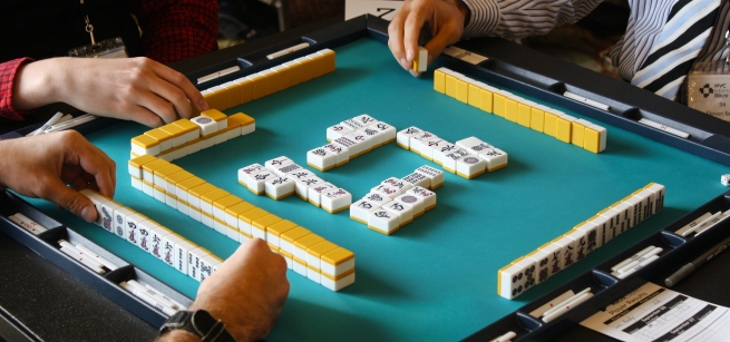 Image of players playing mah jonng