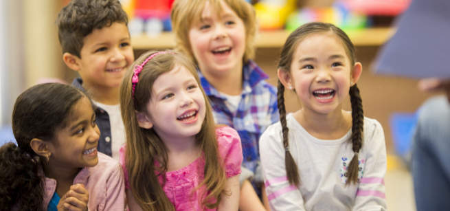 A group of children sitting in a group