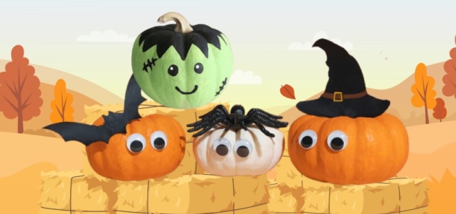 Four mini pumpkins with googly eyes and Halloween accessories seated on bales of hay.