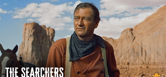 a man and his horse in the desert surrounded by mountains