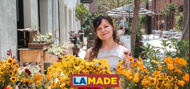 victoria steger in front of flower displays