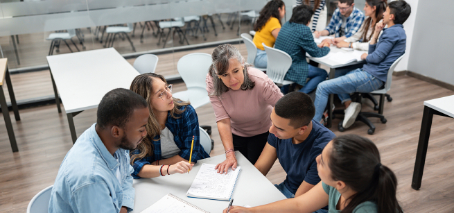 A teacher providing literacy instruction to adult learners.