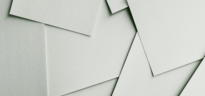 sheets of white paper overlapping 
