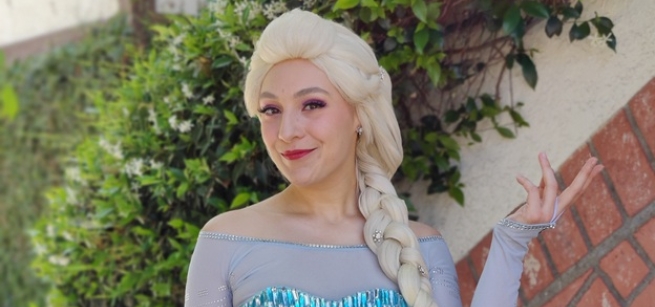 Female with blonde wig and blue princess dress