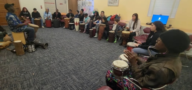Many people in a drum circle