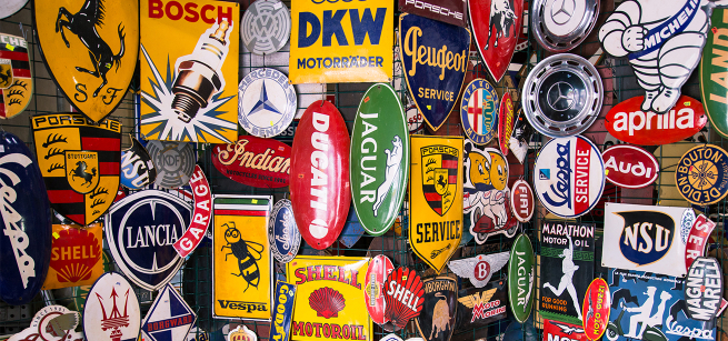 collage of stickers of automotive brands: Jaguar, Mercedes Benz,etc