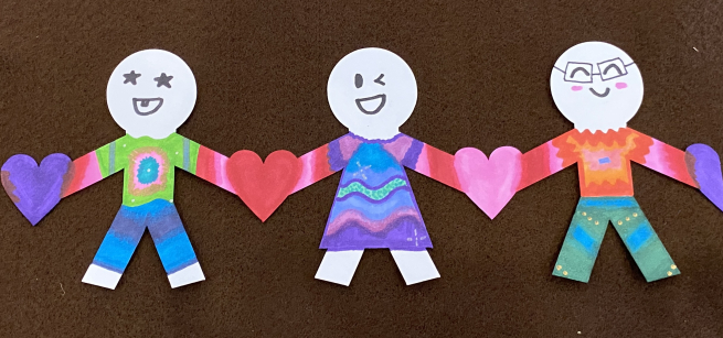 Craft of three people holding heart hands
