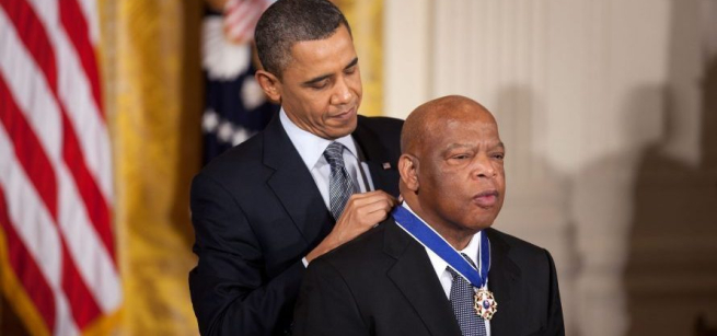 President Obama placed an honorary medal around John Lewis's neck. 
