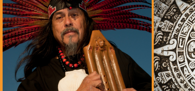 Martin Espino in Indigenous clothing and headdress with a flute
