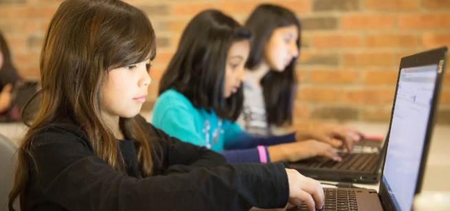 Young students working on laptops