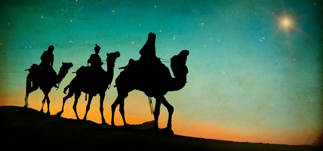 sunset and three kings on camels silhoutte on desert