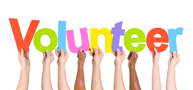 Word volunteer spelled out with arms and hands