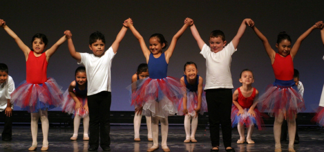 image of kids on a stage
