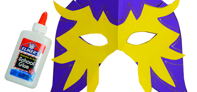 Lucha Libre mask made from purple and yellow construction paper shown with a bottle of Elmer's glue