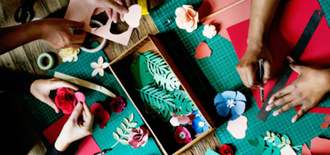 group of people working on paper craft