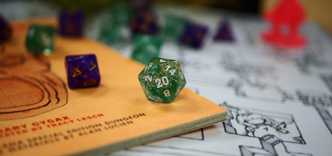 A handful of many sided dice rolled on a table.