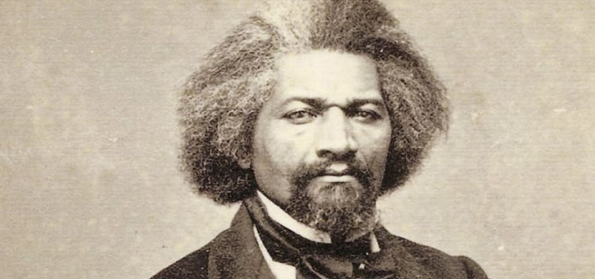 Black and white photo of Frederick Douglass in 19th century suit