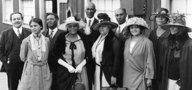 Historic photo of several African American people dressed in formal attire