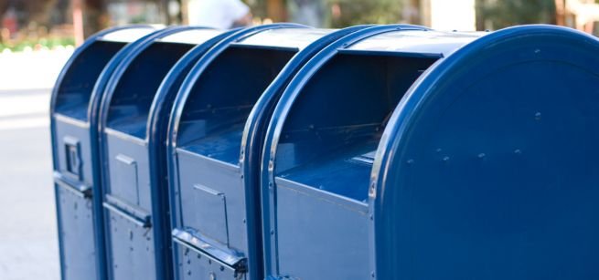 Four blue mailboxes