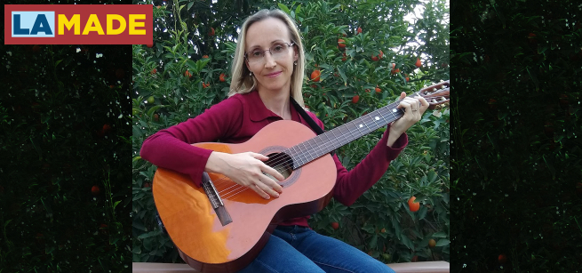 Natalya Grinbaum-Smyrnos playing guitar