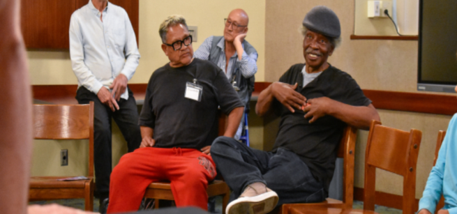 individuals participating in neighborhood sing program