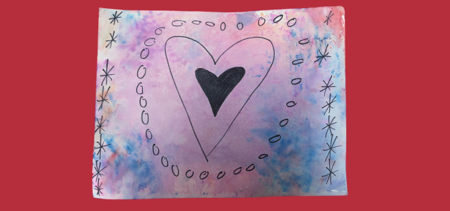  A heart drawn in black sharpie on a watercolor background.